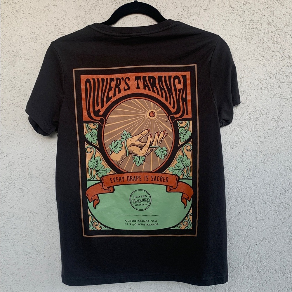 Oliver’s Taranga Vineyards.  Dark grey tee shirt w/ graphic print